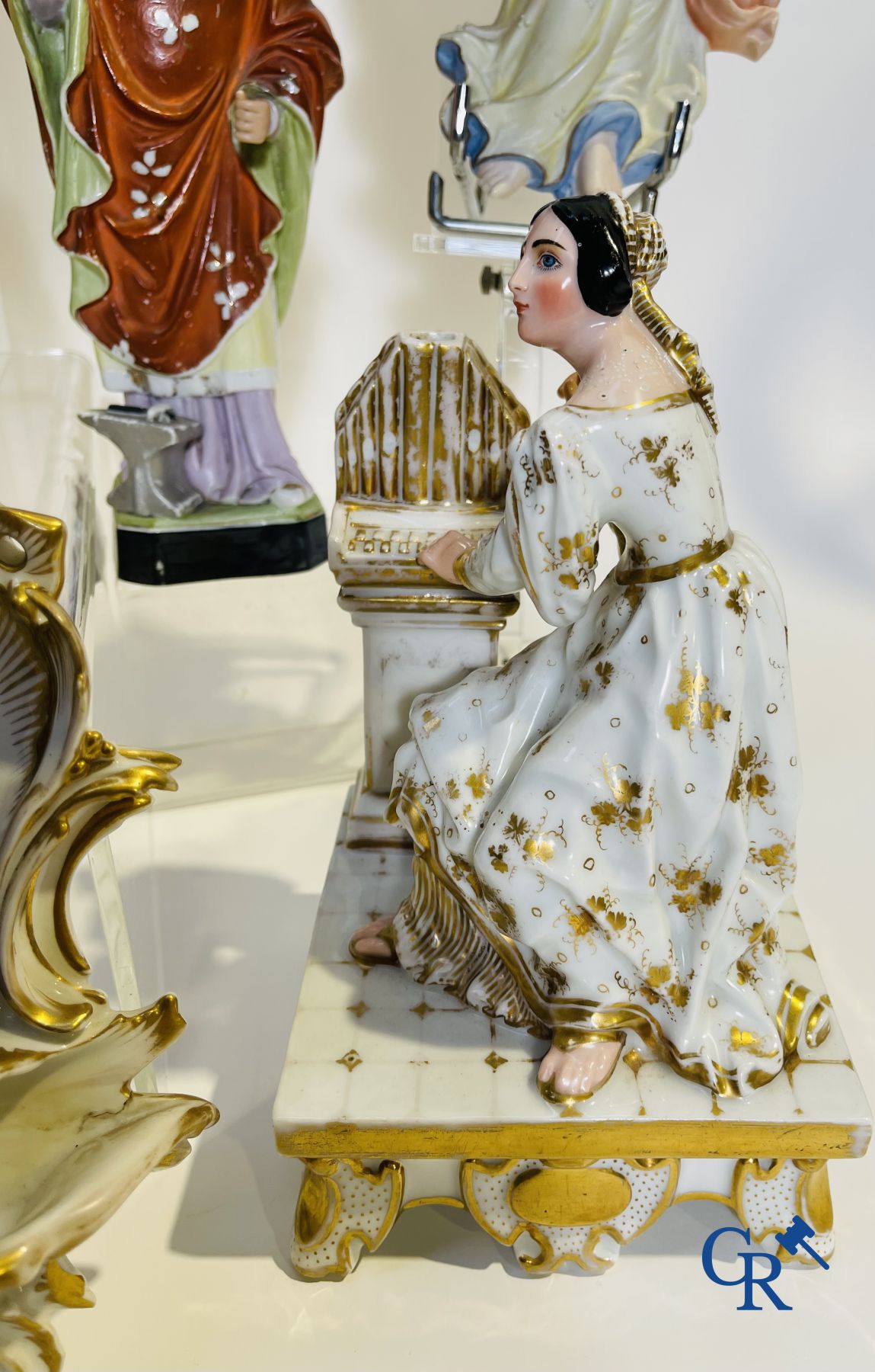 A various lot holy water barrels, shrines and others in porcelain and biscuit.