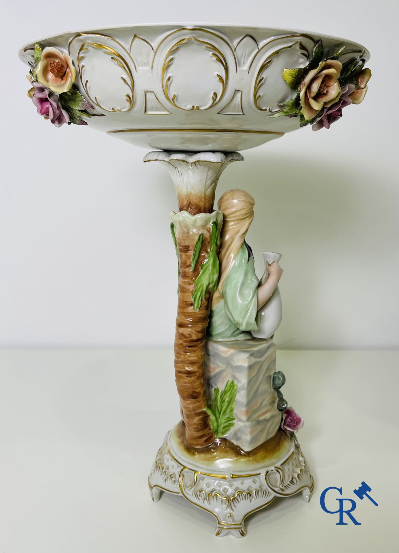 A pair of table centrepieces in German polychrome porcelain.