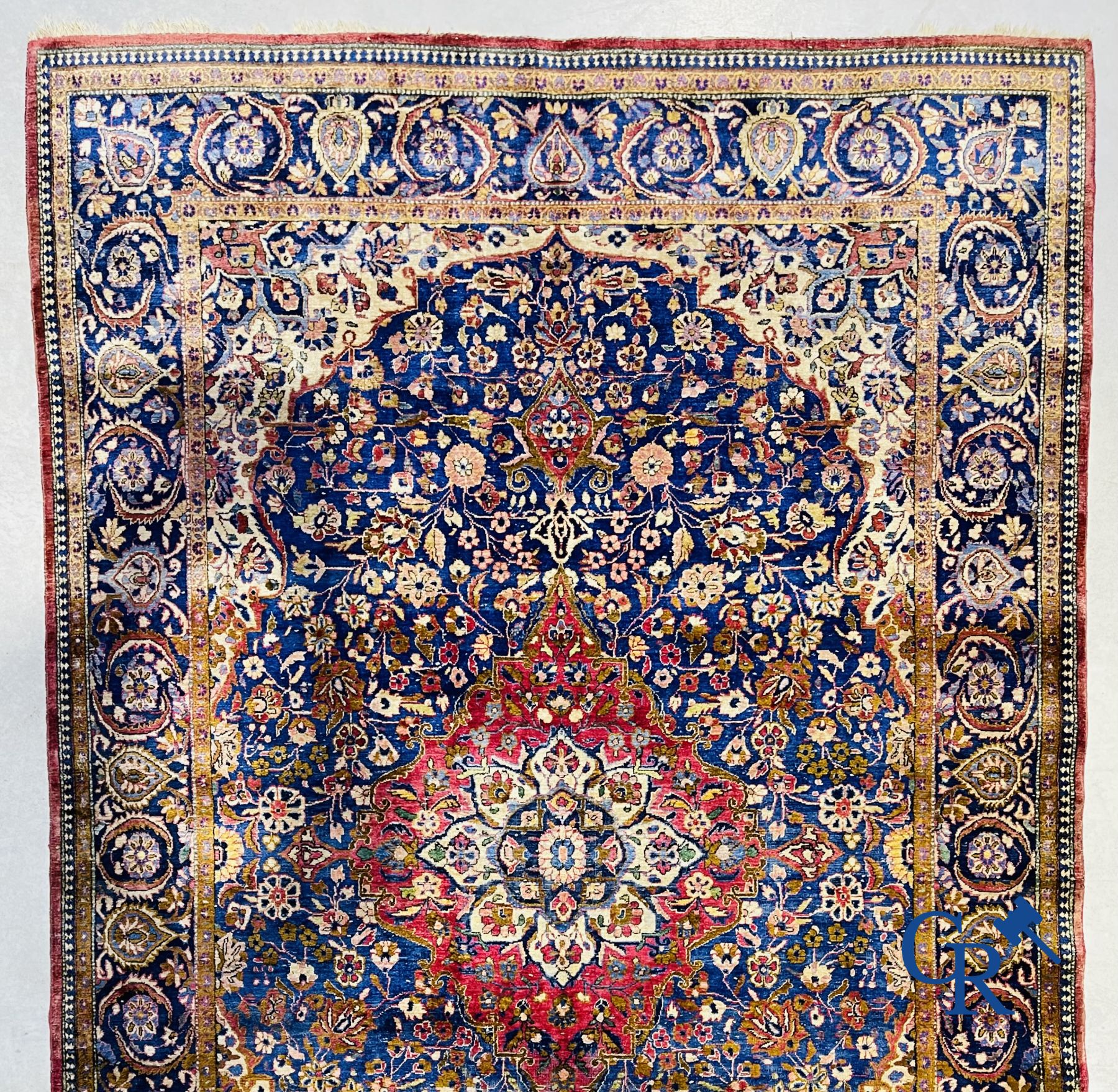 Oriental carpets: Antique silk carpet with floral decor.