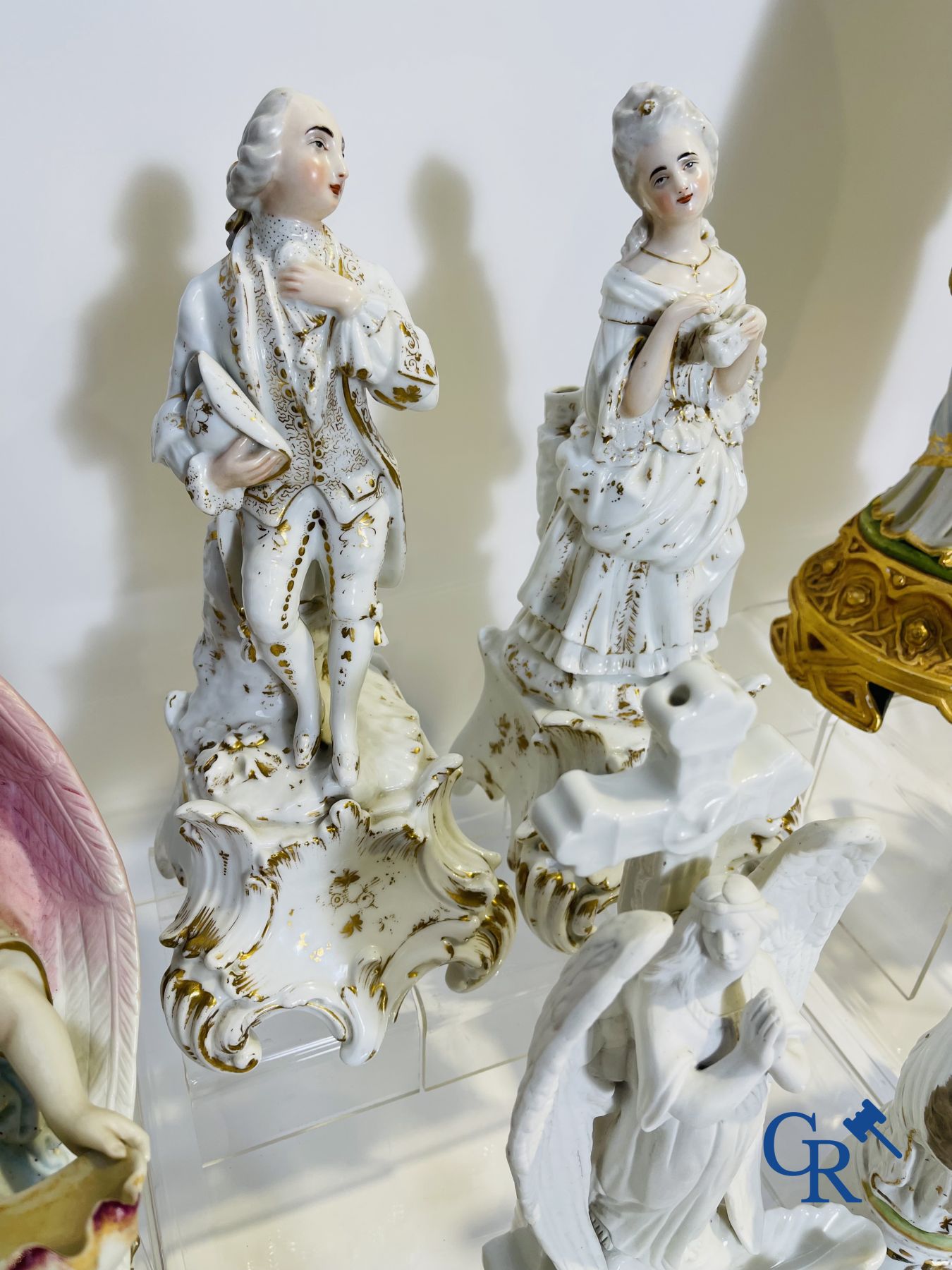 A various lot holy water barrels, shrines and others in porcelain and biscuit.