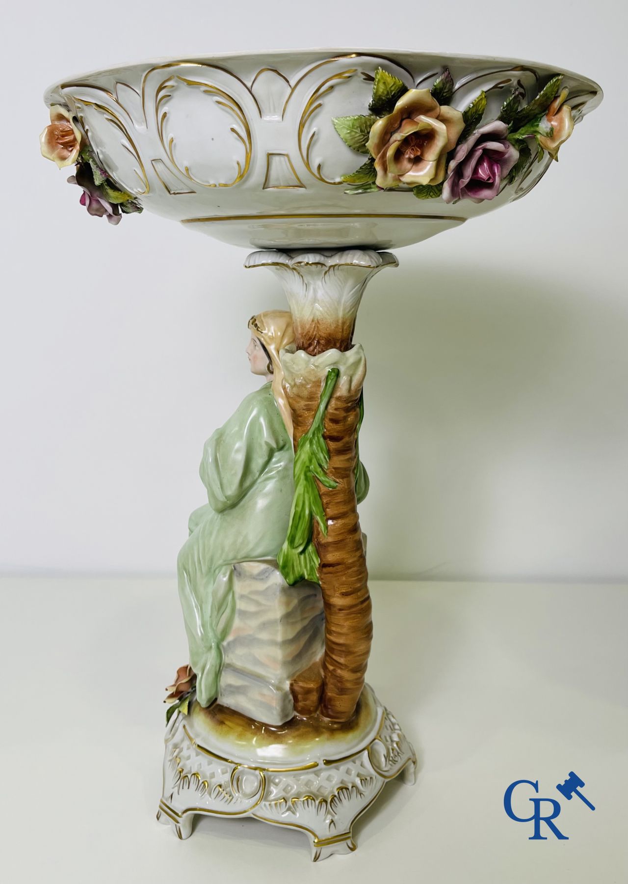 A pair of table centrepieces in German polychrome porcelain.