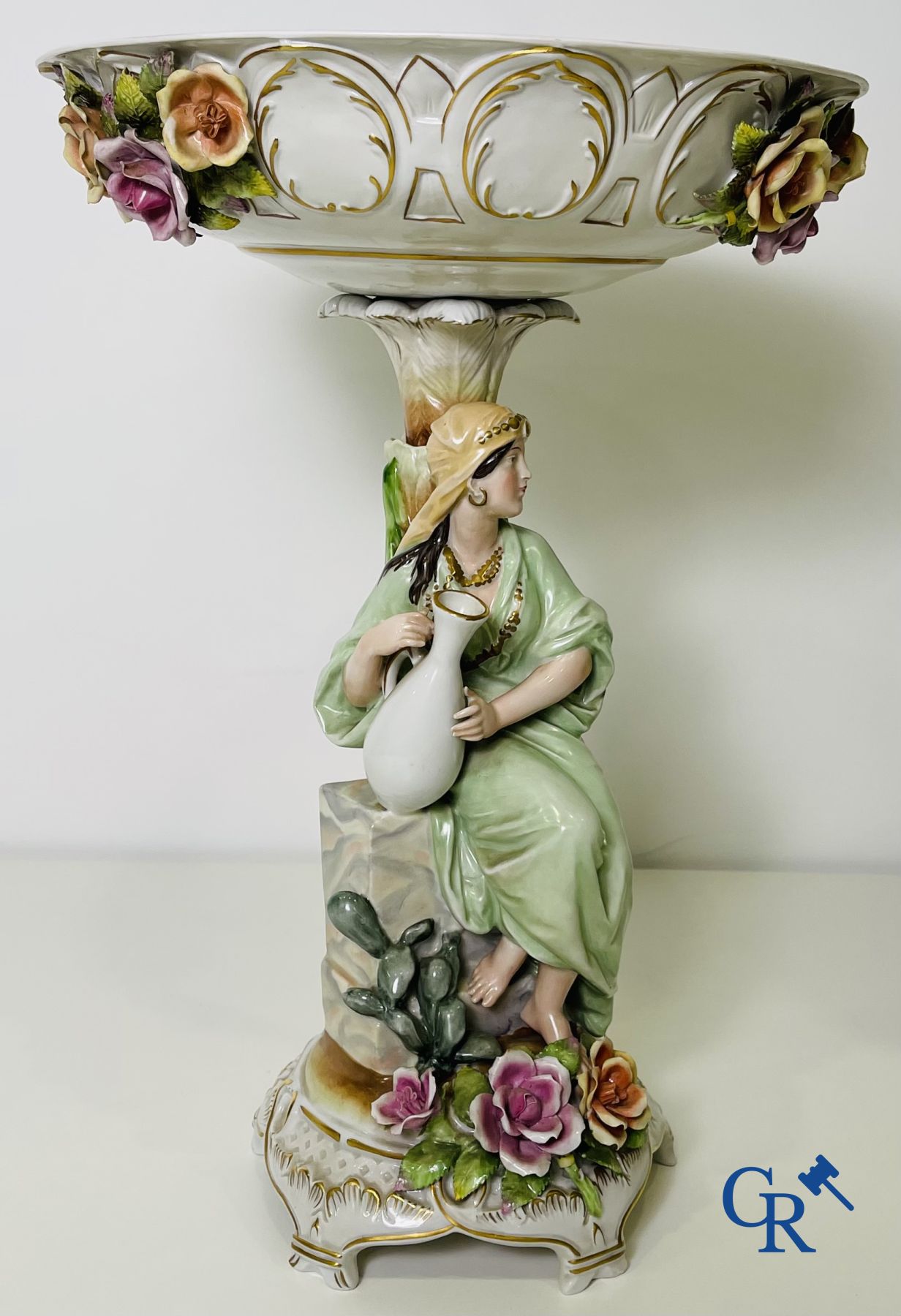 A pair of table centrepieces in German polychrome porcelain.