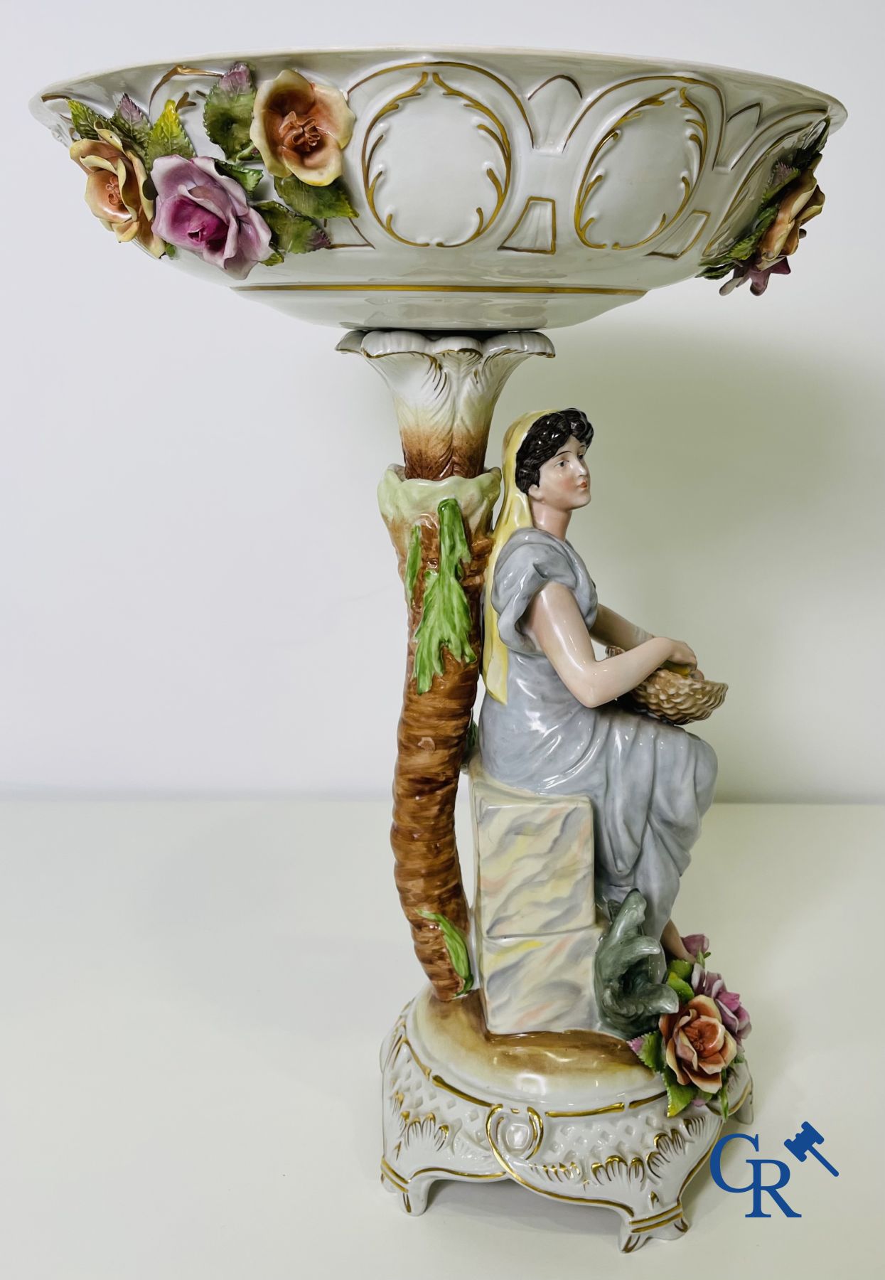 A pair of table centrepieces in German polychrome porcelain.