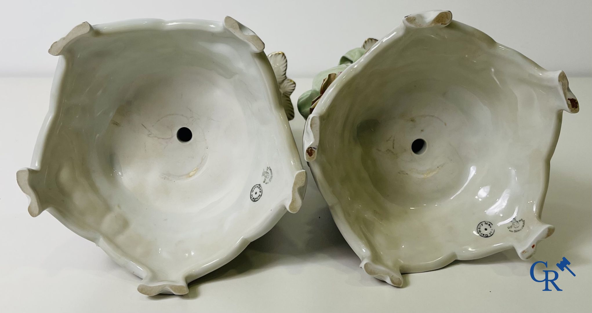 A pair of table centrepieces in German polychrome porcelain.