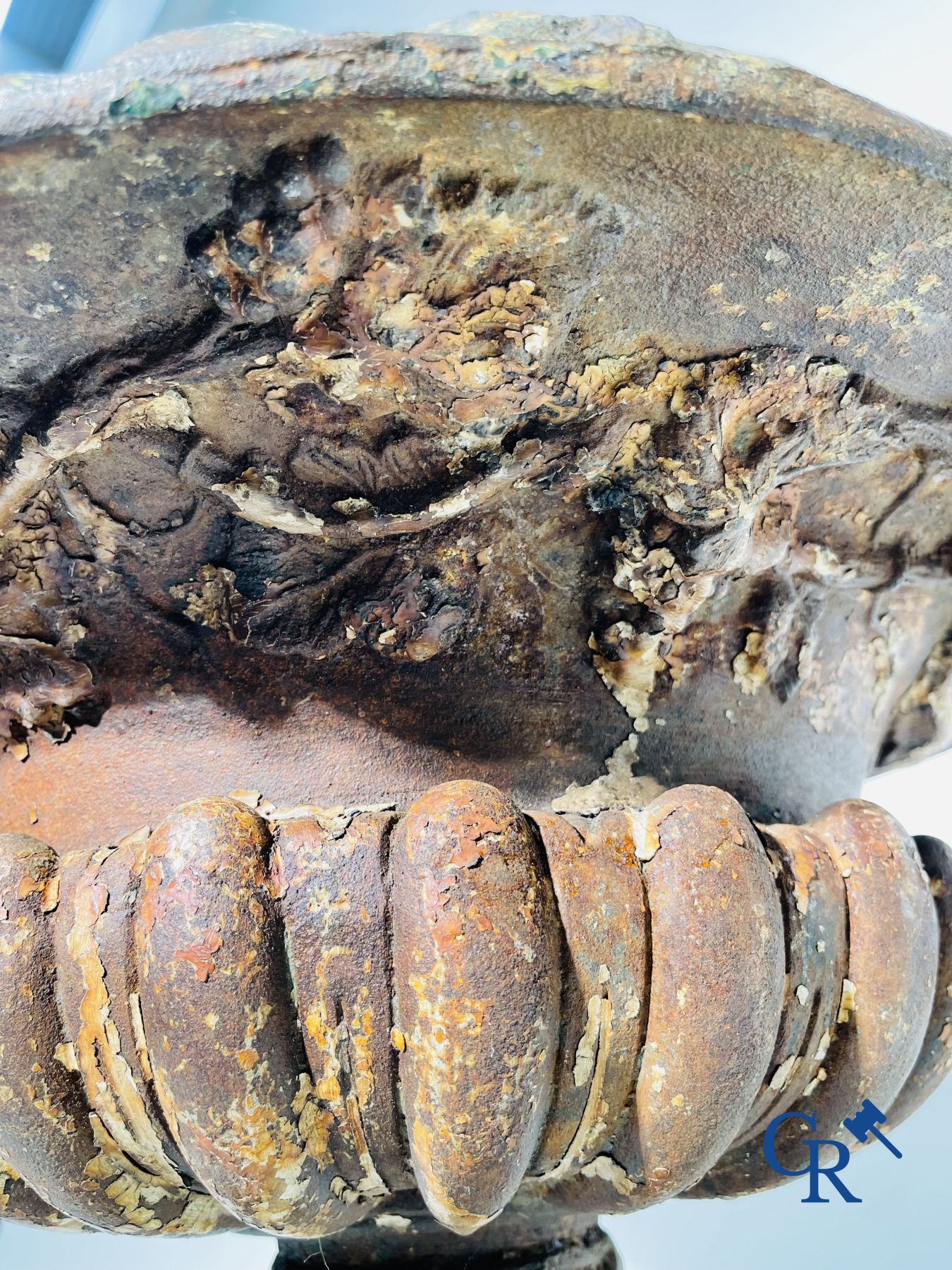 A 19th century cast iron garden vase decorated with grapevines.