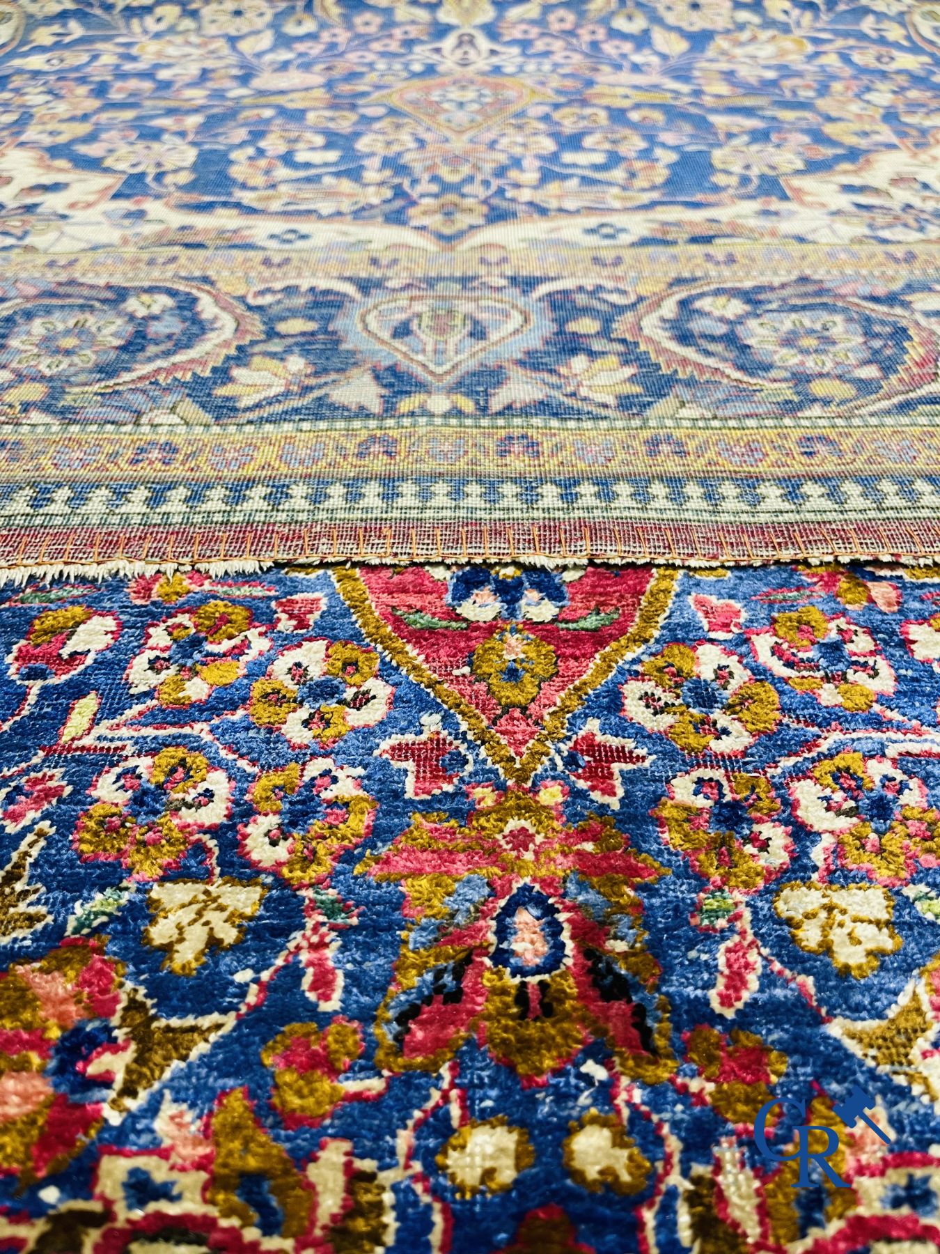Oriental carpets: Antique silk carpet with floral decor.