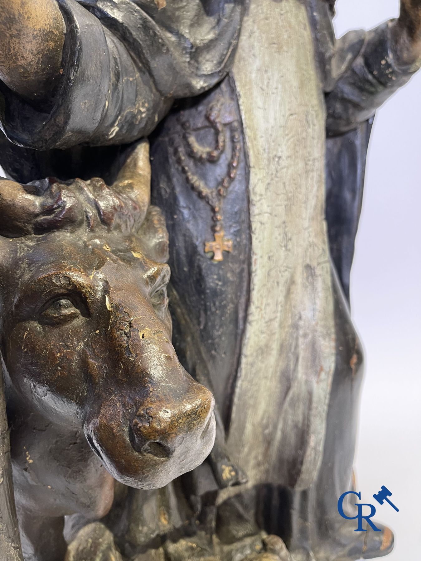 Imposing 17th century polychrome wooden statue of a Saint accompanied by a cow, a pig and a sheep.