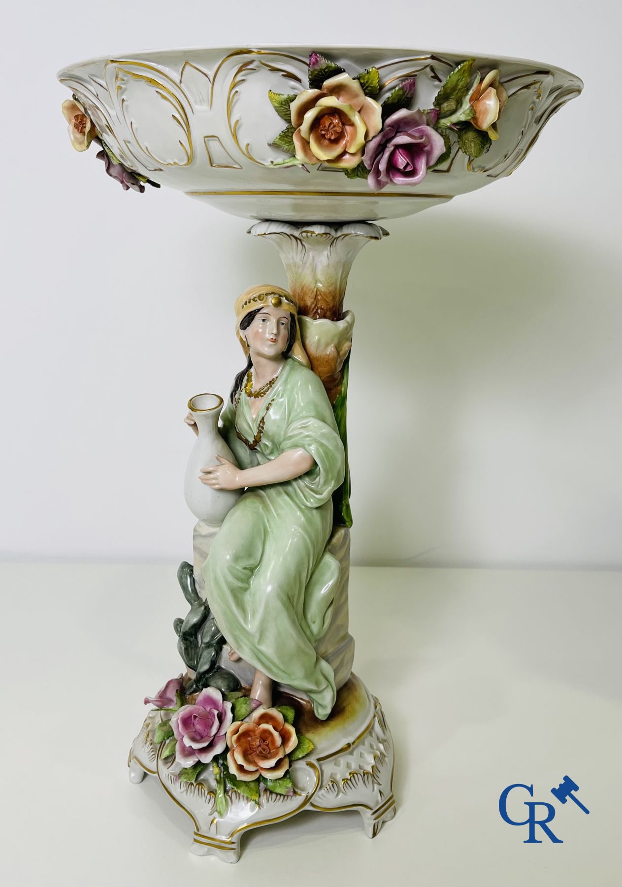 A pair of table centrepieces in German polychrome porcelain.