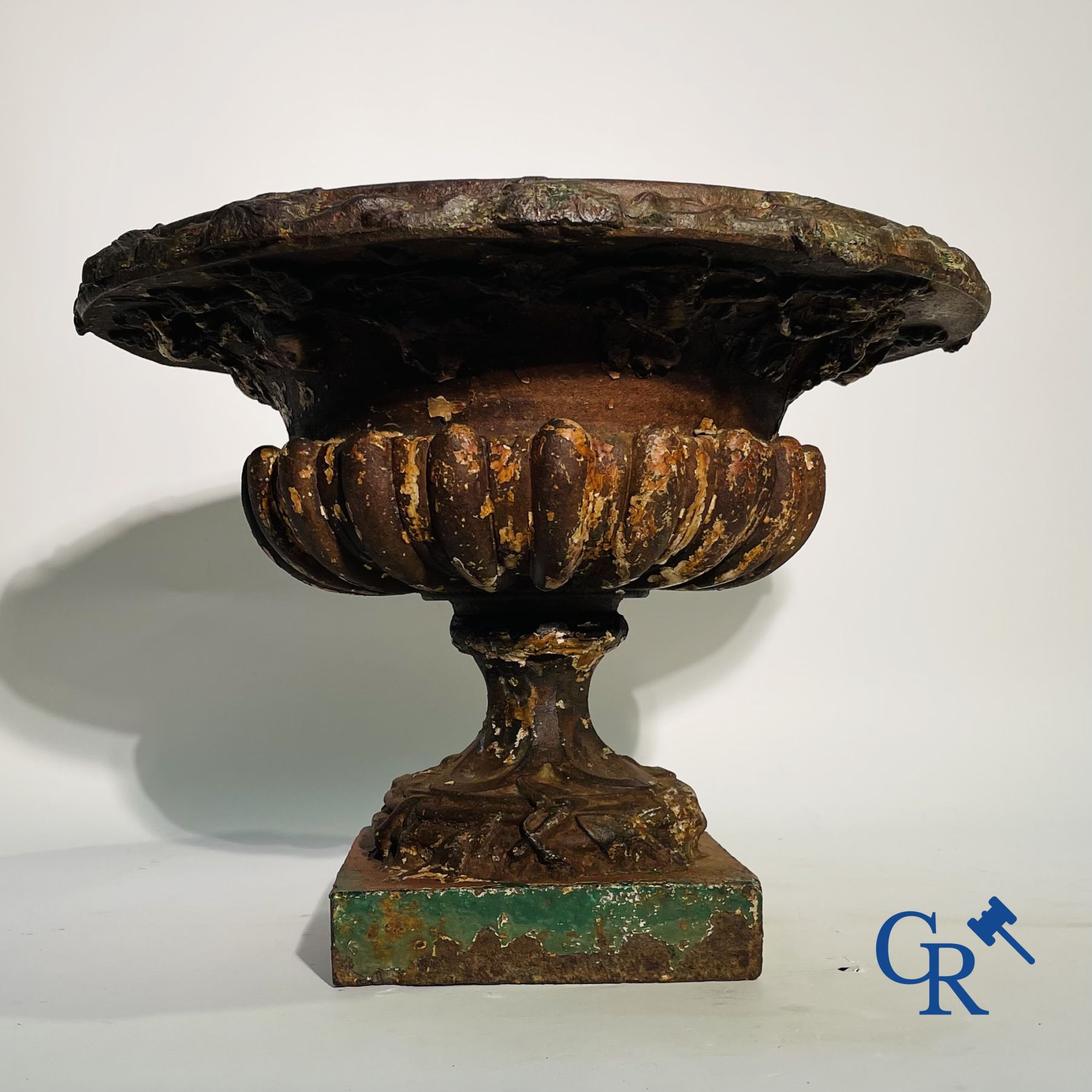 A 19th century cast iron garden vase decorated with grapevines.
