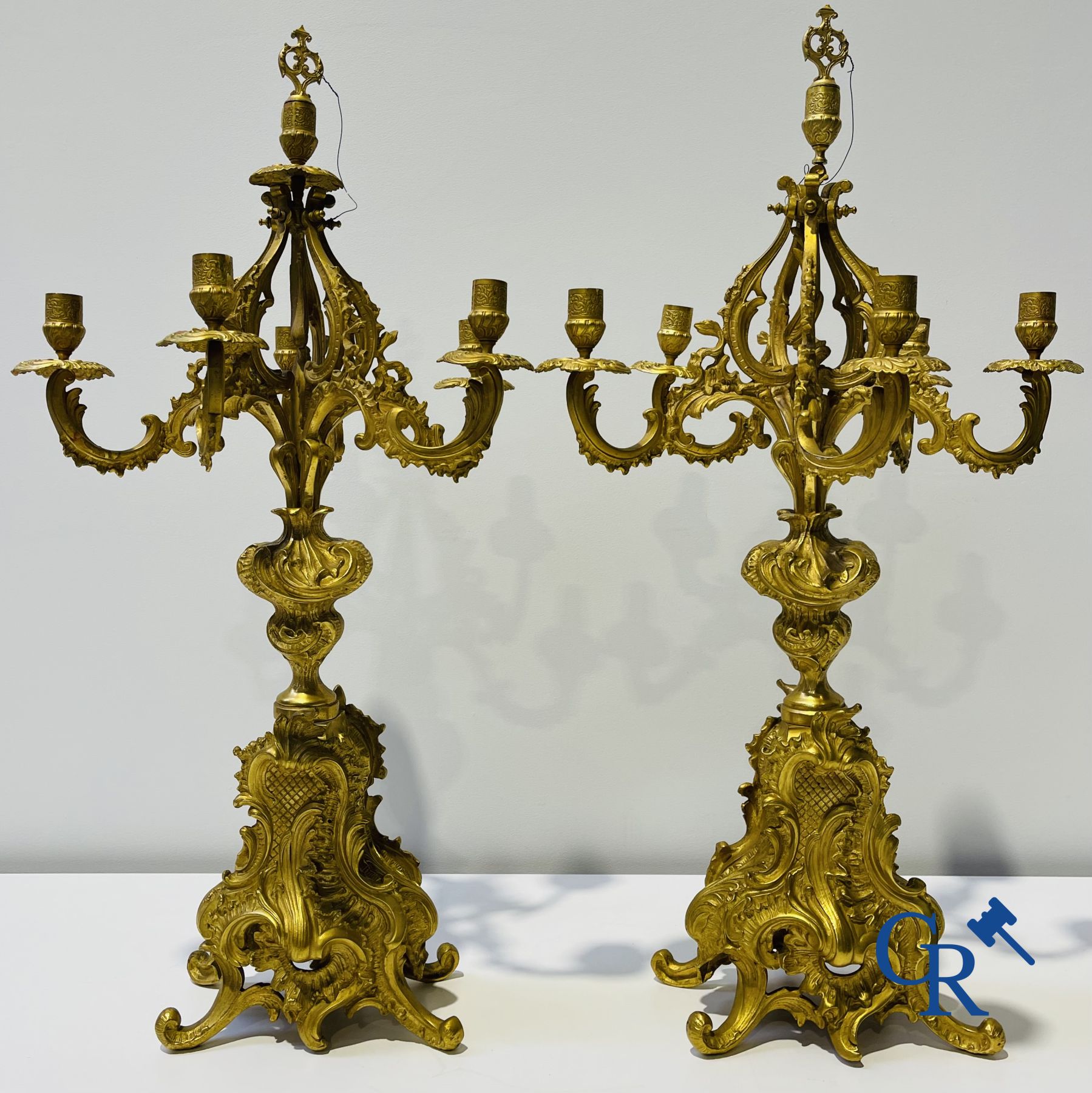 A large 3-piece fire-gilded bronze chimney set in LV style. 19th century.