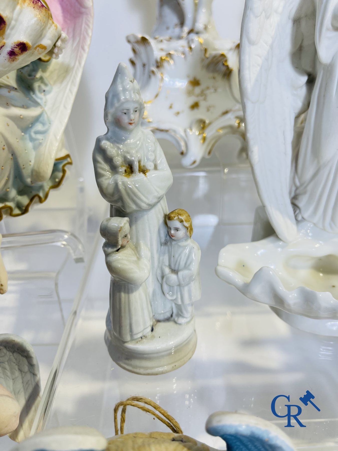 A various lot holy water barrels, shrines and others in porcelain and biscuit.