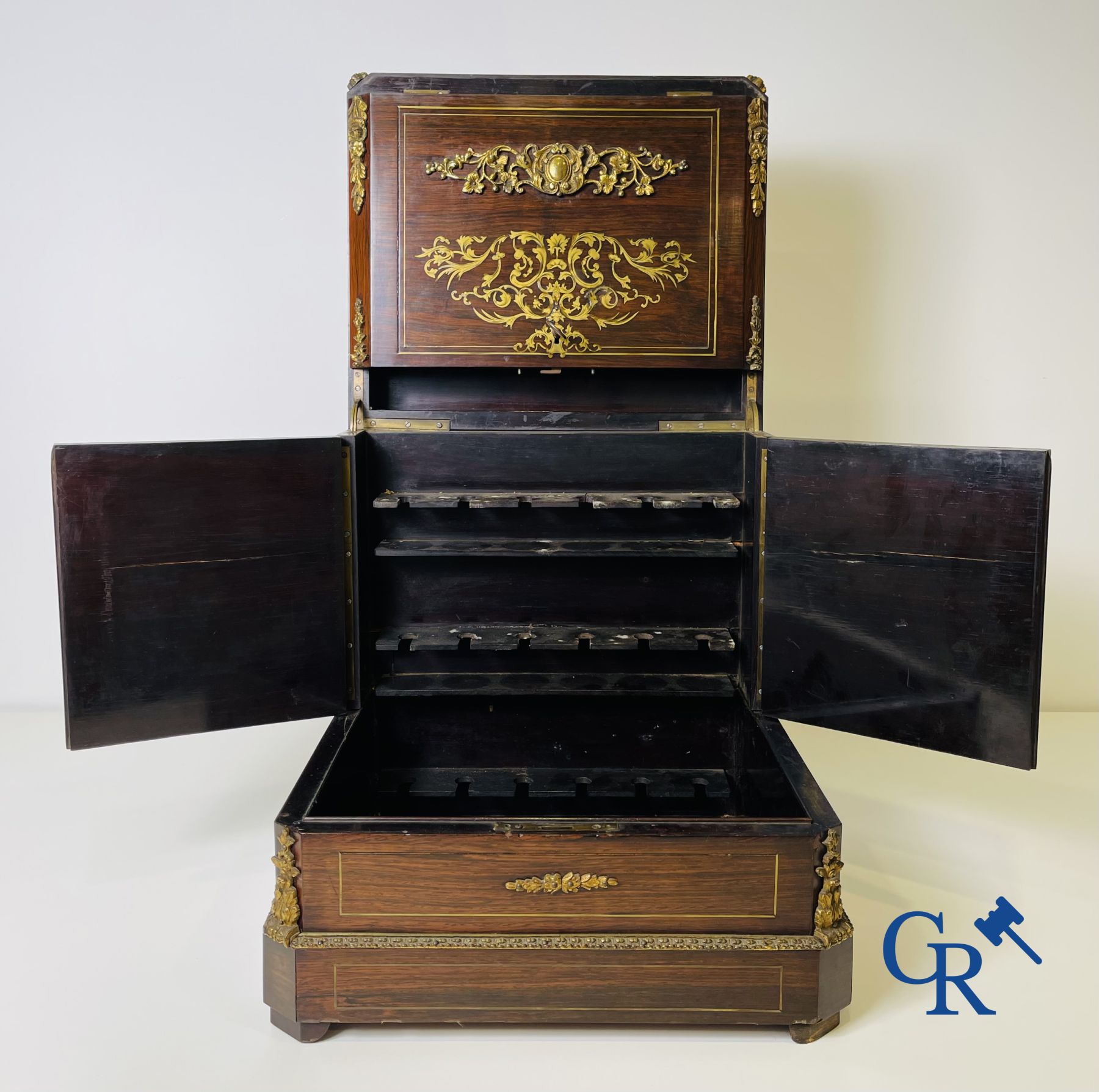 An imposing rosewood liqueur case with bronze fittings and inlays in Boulle style. 19th century.