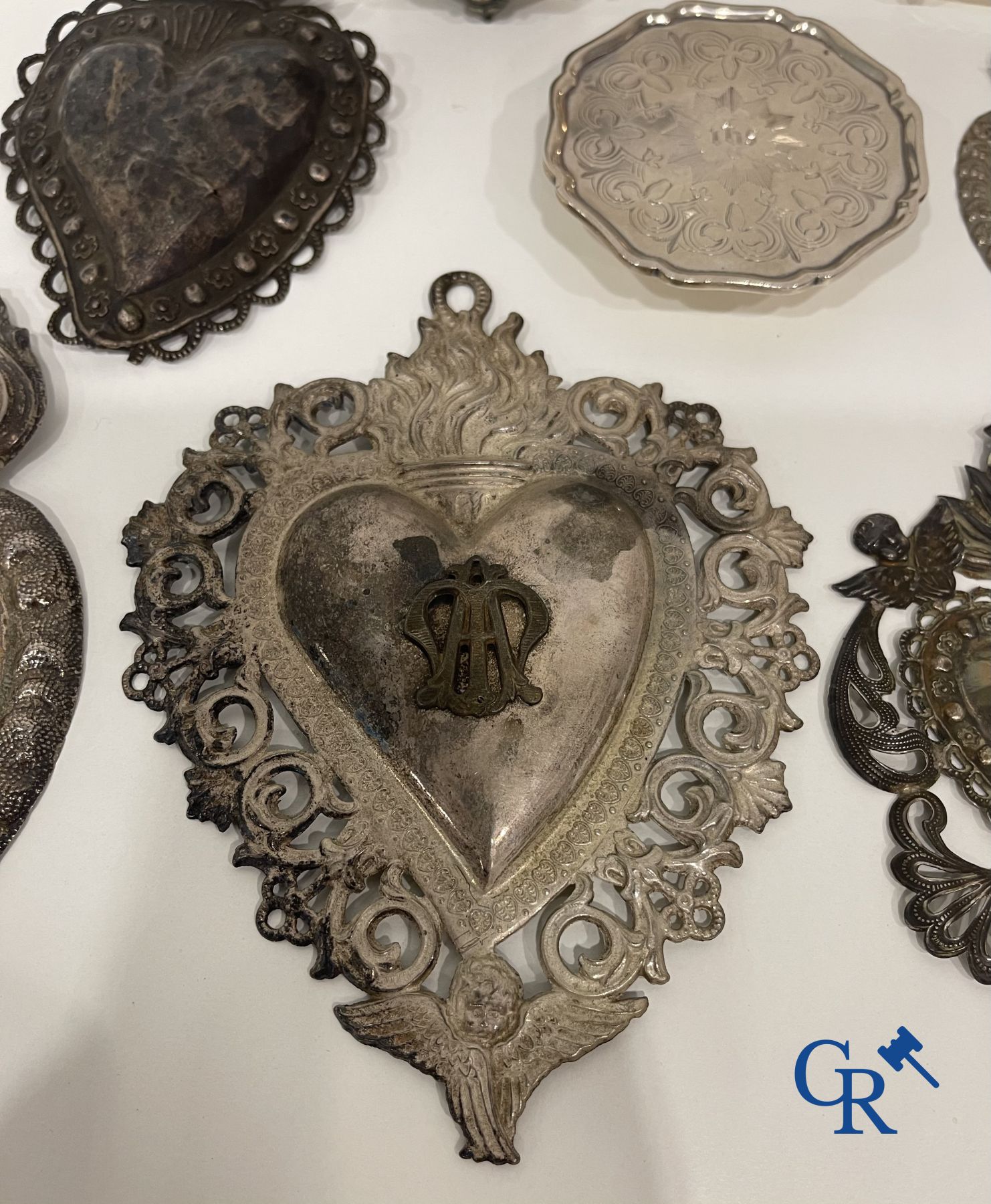 A lot of 9 pieces of various religious objects in silver. 18th-19th century