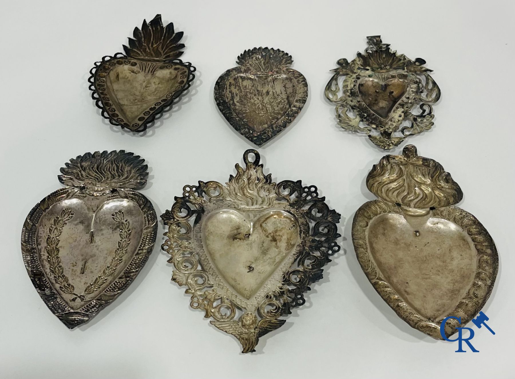 A lot of 9 pieces of various religious objects in silver. 18th-19th century