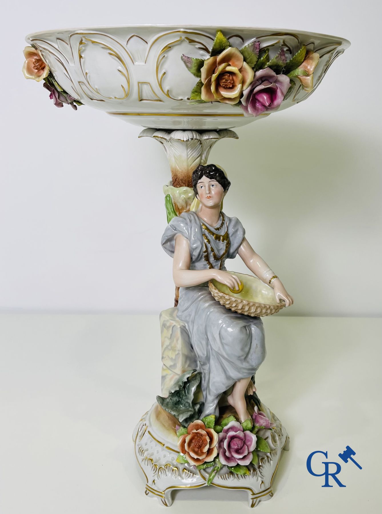 A pair of table centrepieces in German polychrome porcelain.