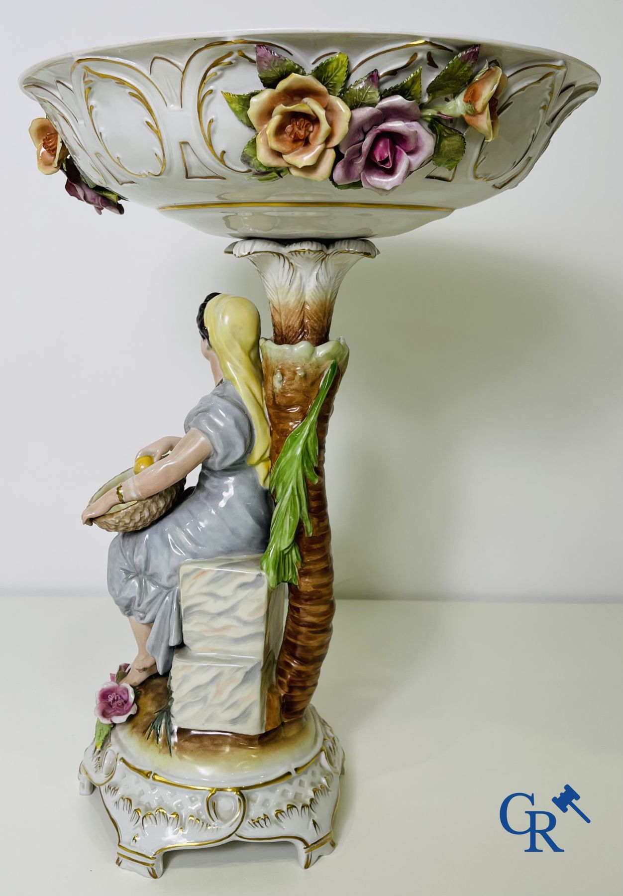 A pair of table centrepieces in German polychrome porcelain.