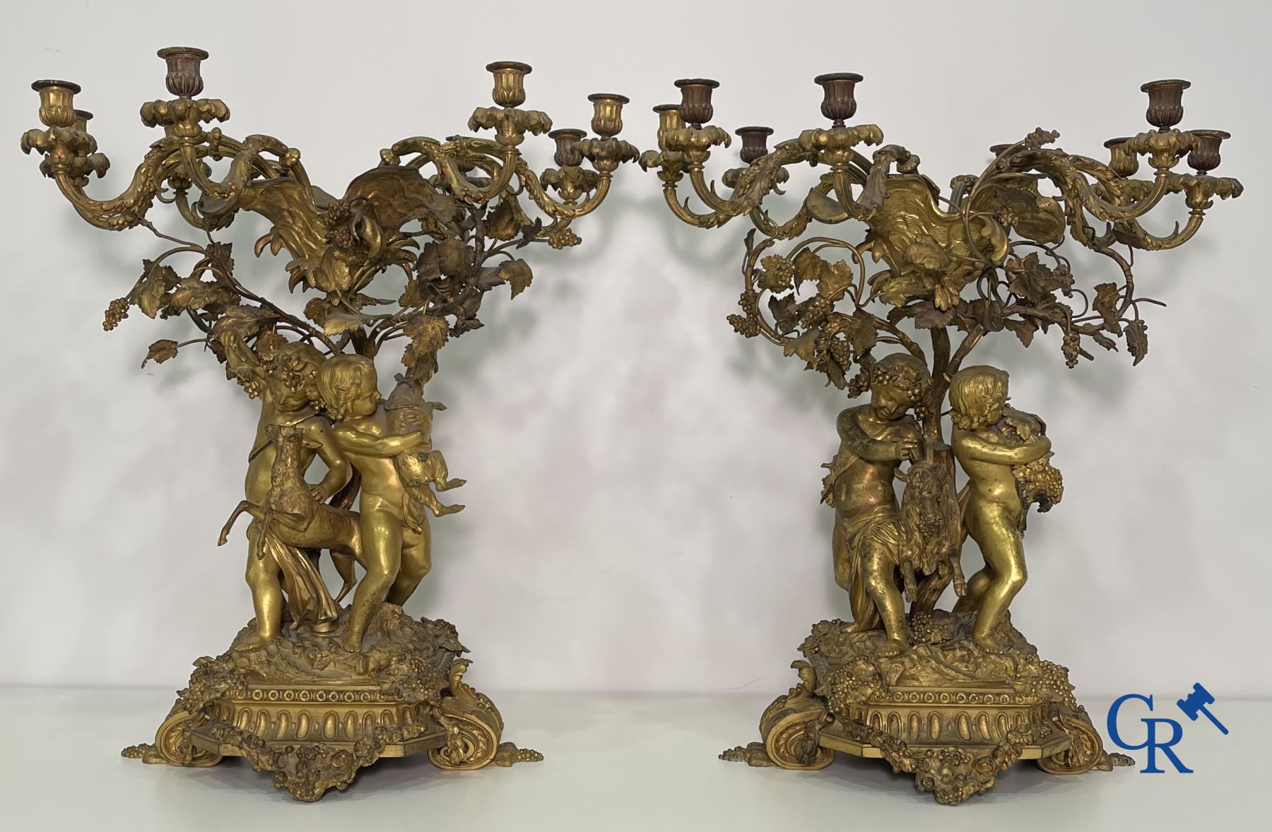 A pair of imposing bronze candlesticks with putti in LXVI style. Napoleon III period.