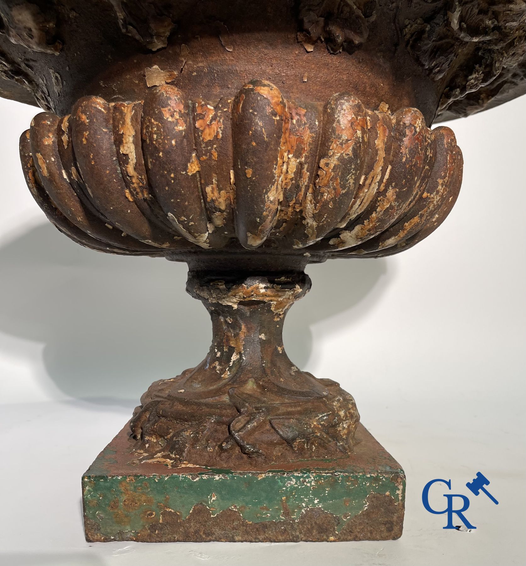 A 19th century cast iron garden vase decorated with grapevines.