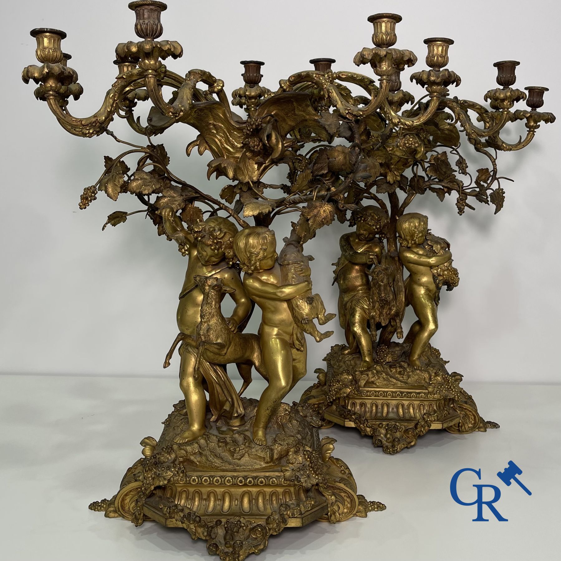 A pair of imposing bronze candlesticks with putti in LXVI style. Napoleon III period.