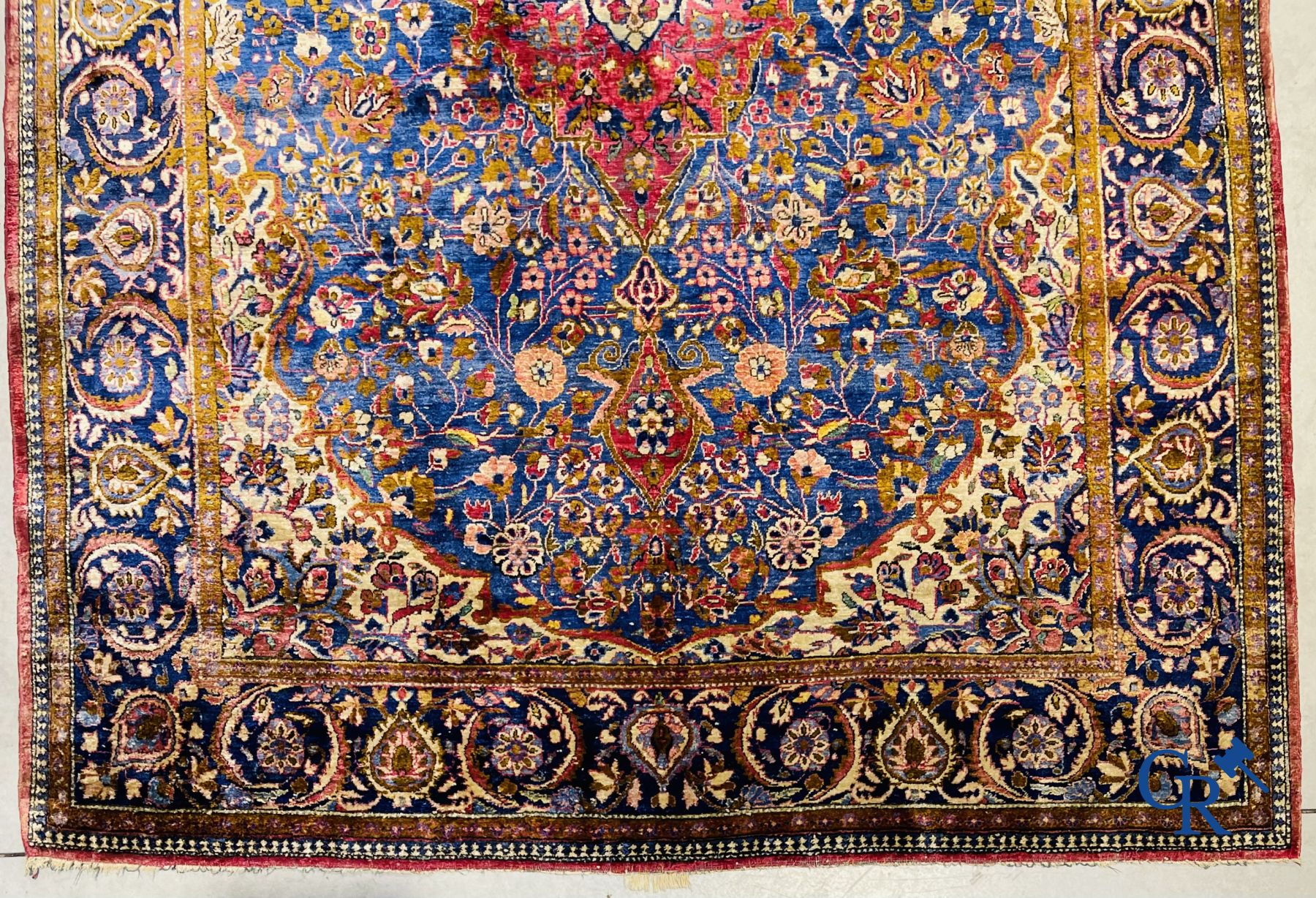 Oriental carpets: Antique silk carpet with floral decor.