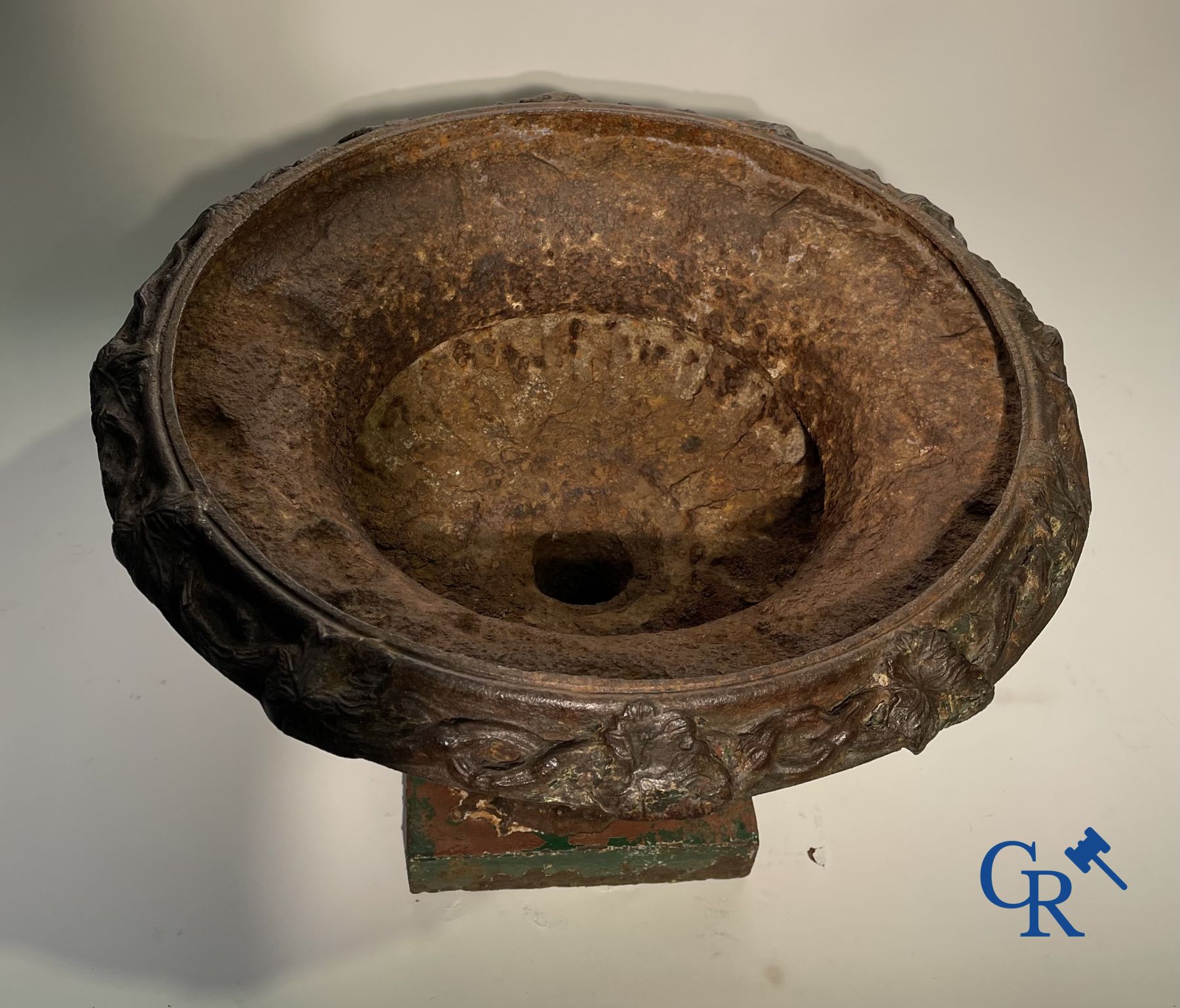 A 19th century cast iron garden vase decorated with grapevines.