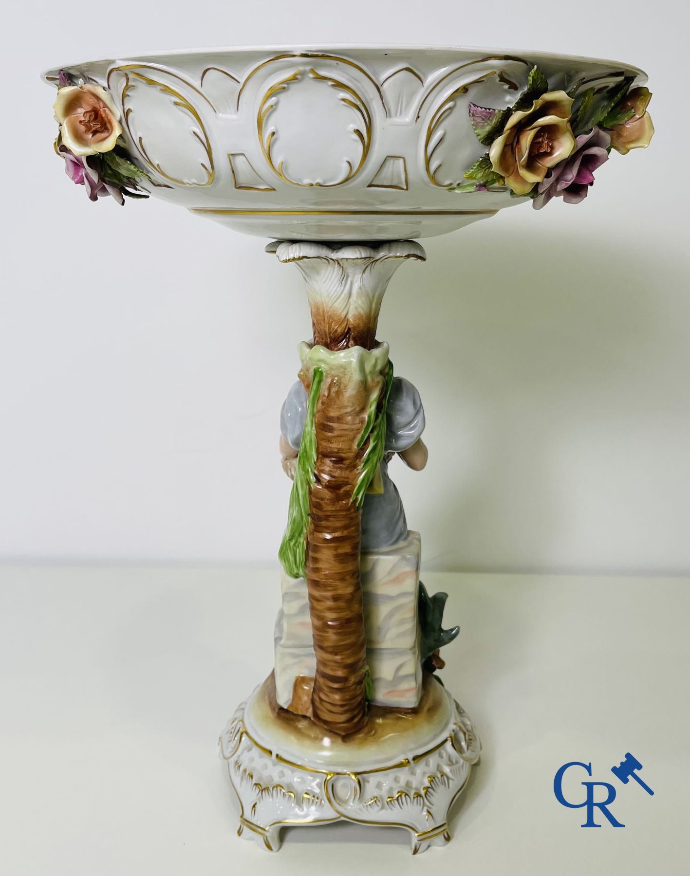 A pair of table centrepieces in German polychrome porcelain.