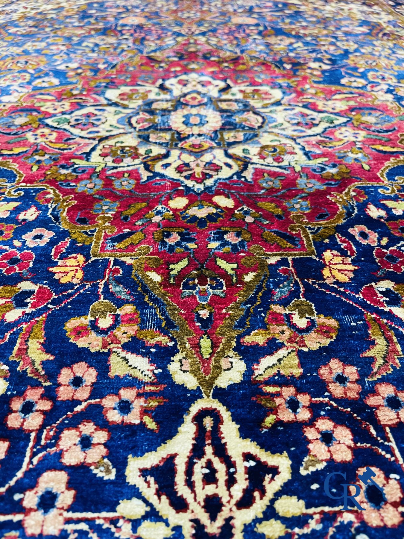 Oriental carpets: Antique silk carpet with floral decor.