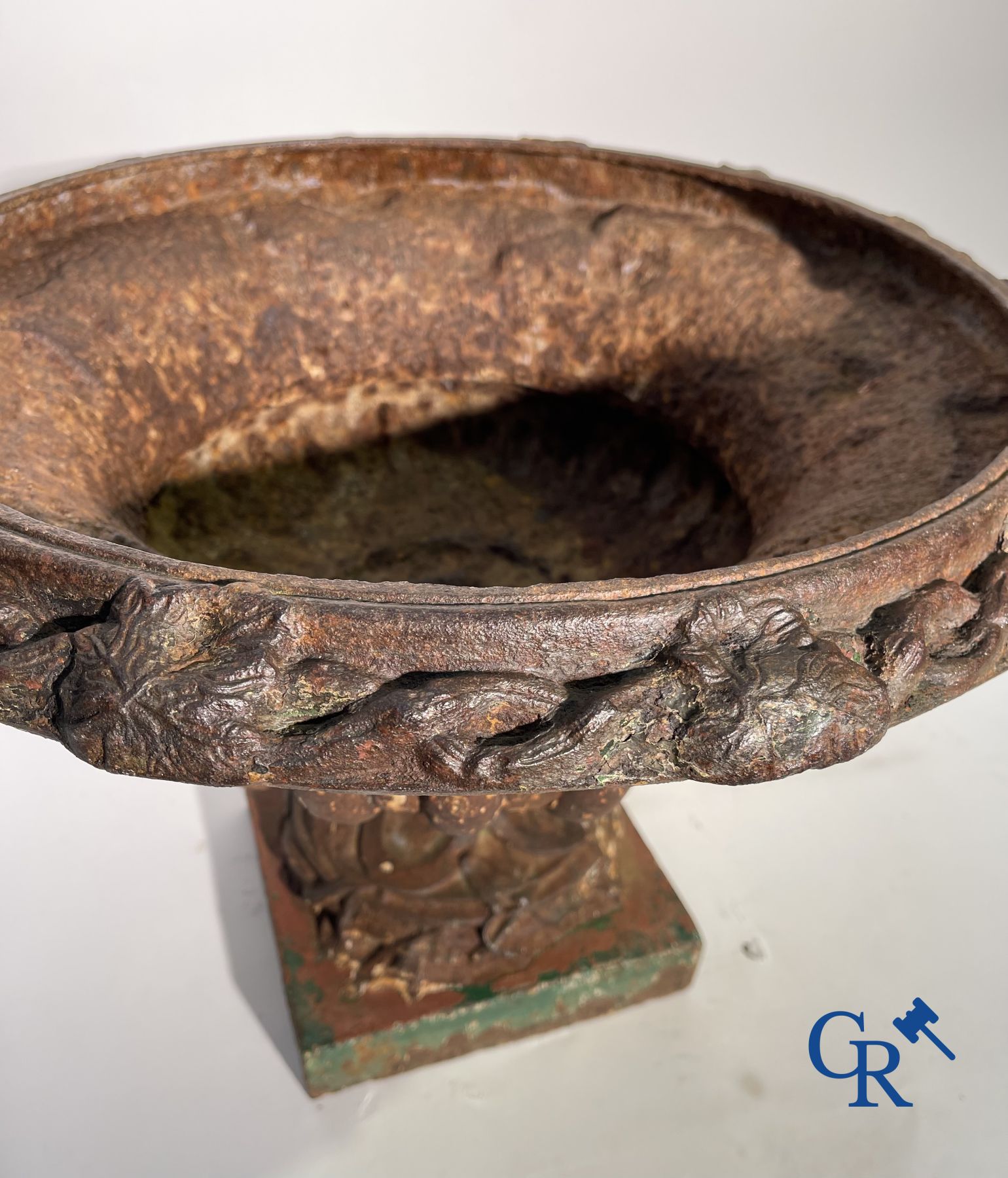 A 19th century cast iron garden vase decorated with grapevines.