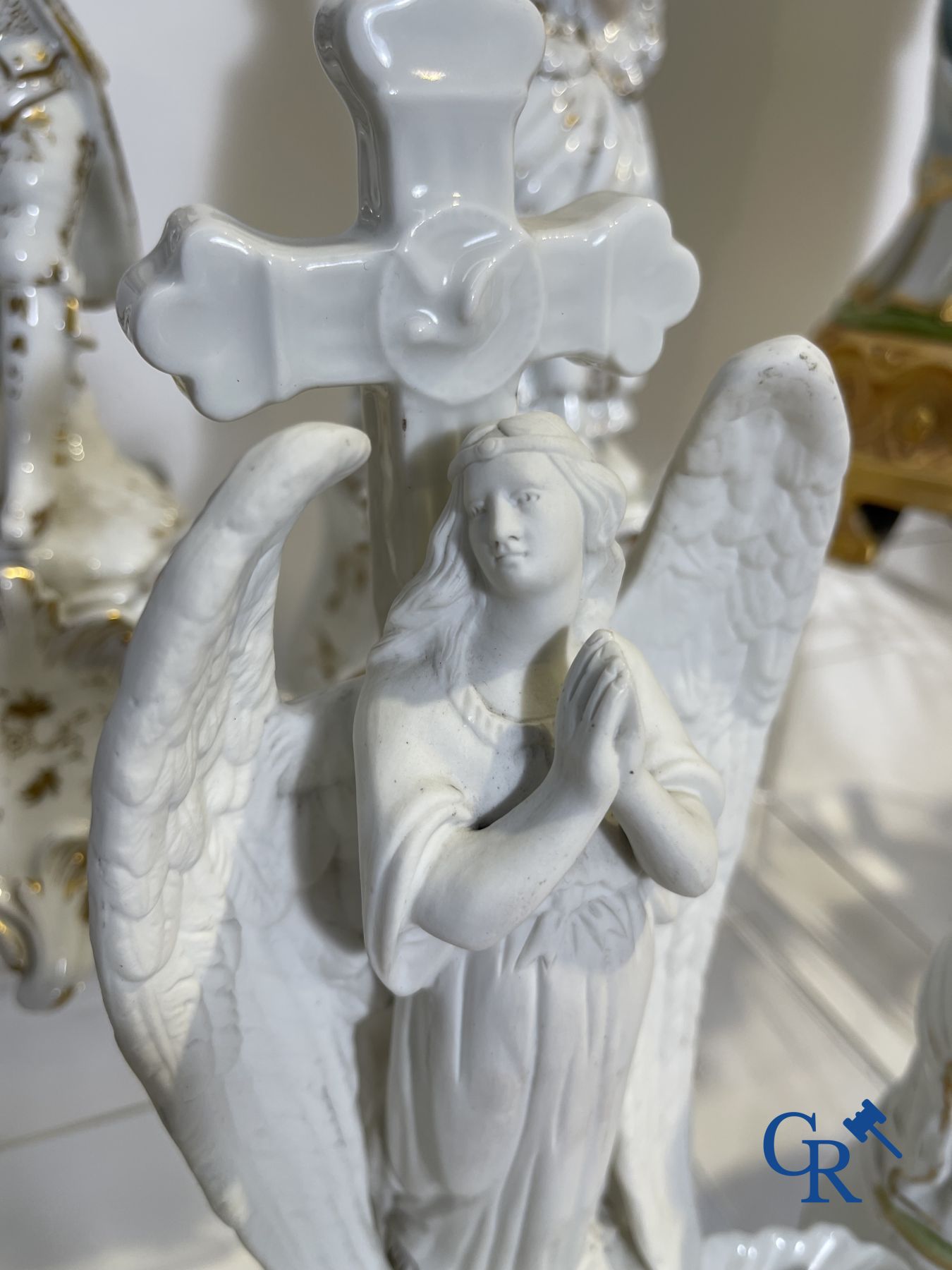 A various lot holy water barrels, shrines and others in porcelain and biscuit.