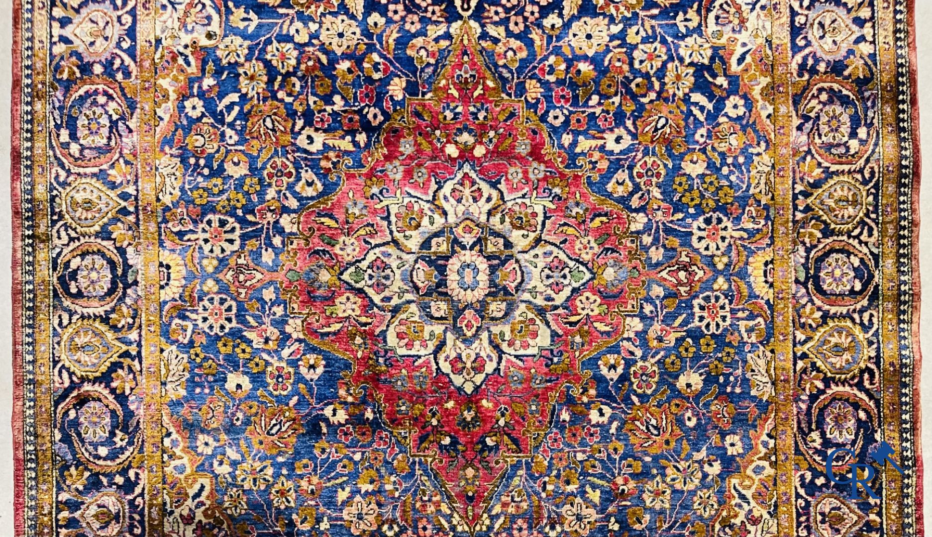 Oriental carpets: Antique silk carpet with floral decor.