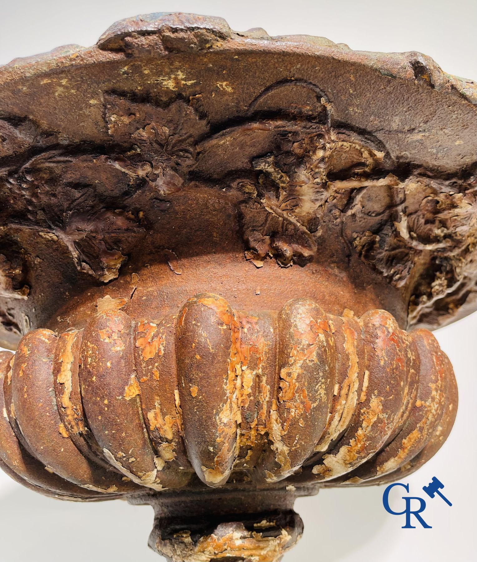 A 19th century cast iron garden vase decorated with grapevines.