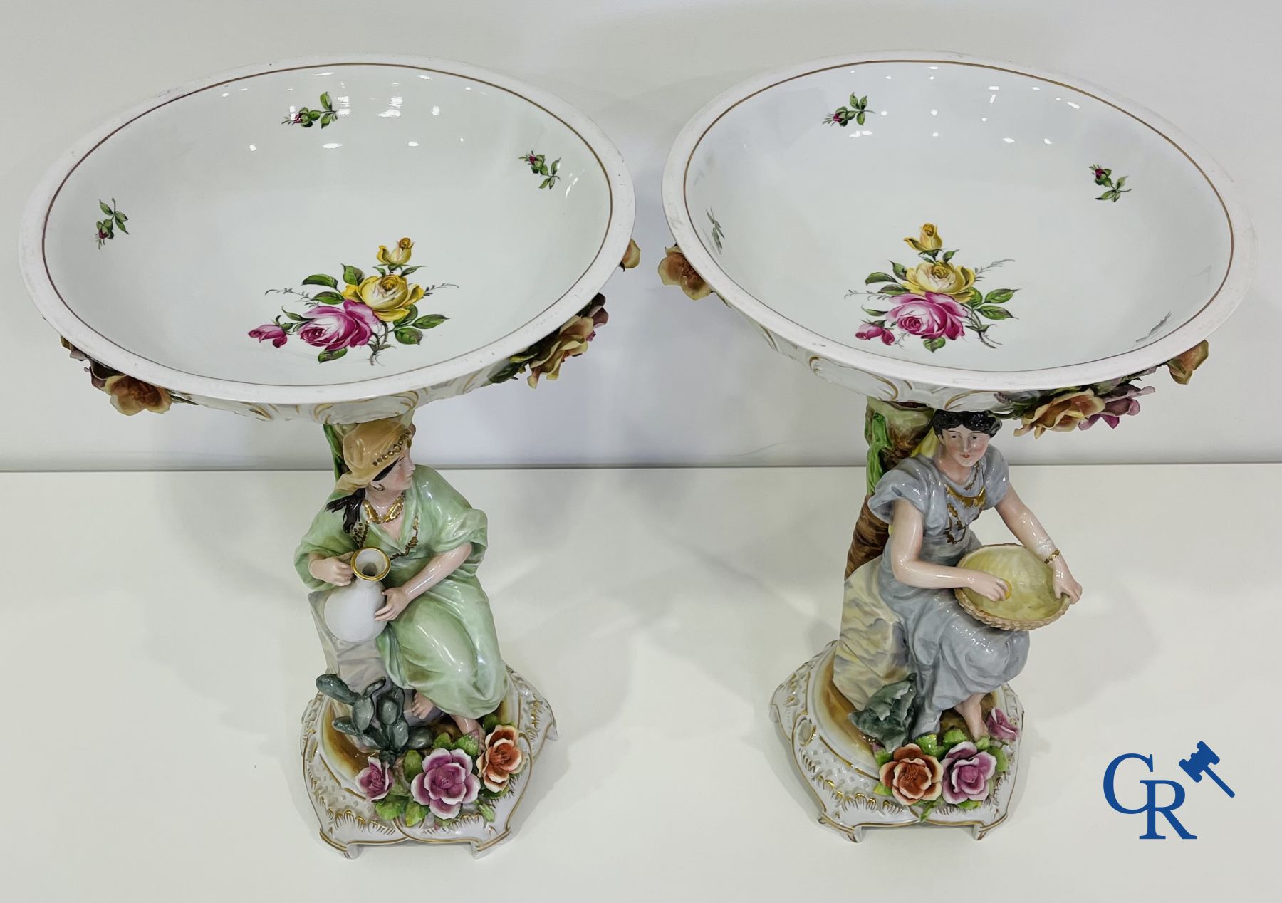 A pair of table centrepieces in German polychrome porcelain.