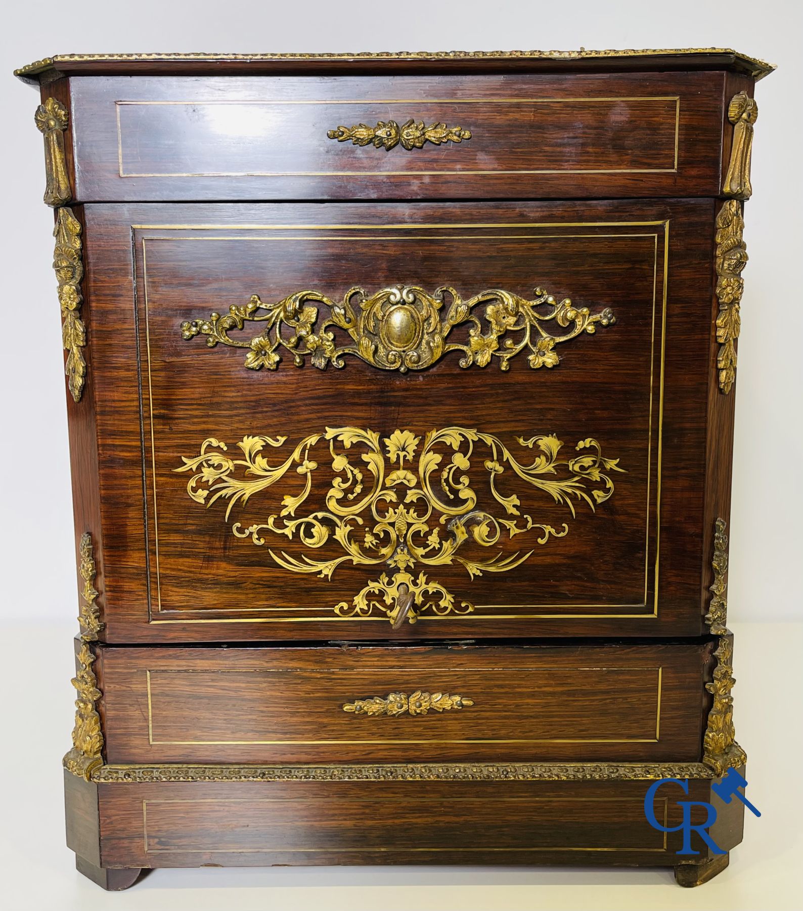 An imposing rosewood liqueur case with bronze fittings and inlays in Boulle style. 19th century.