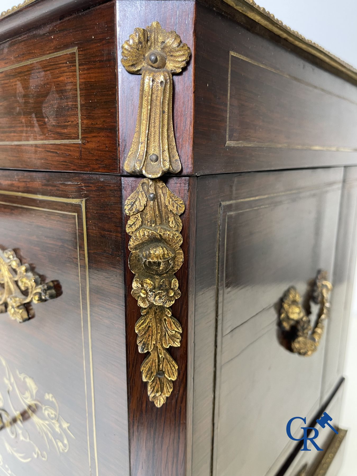 An imposing rosewood liqueur case with bronze fittings and inlays in Boulle style. 19th century.