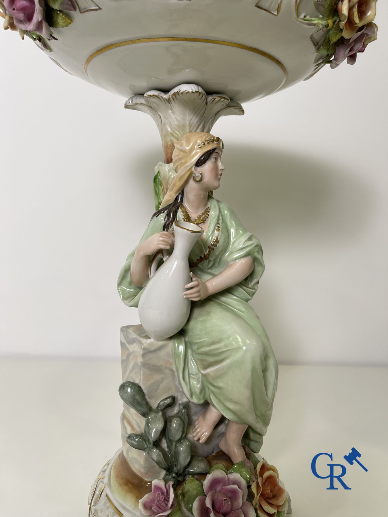 A pair of table centrepieces in German polychrome porcelain.