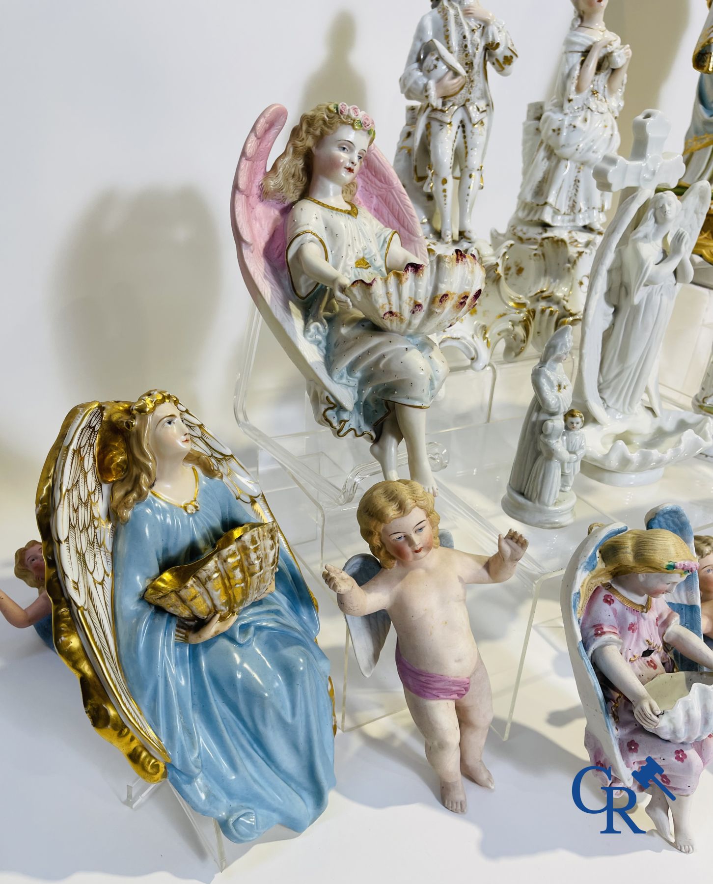 A various lot holy water barrels, shrines and others in porcelain and biscuit.