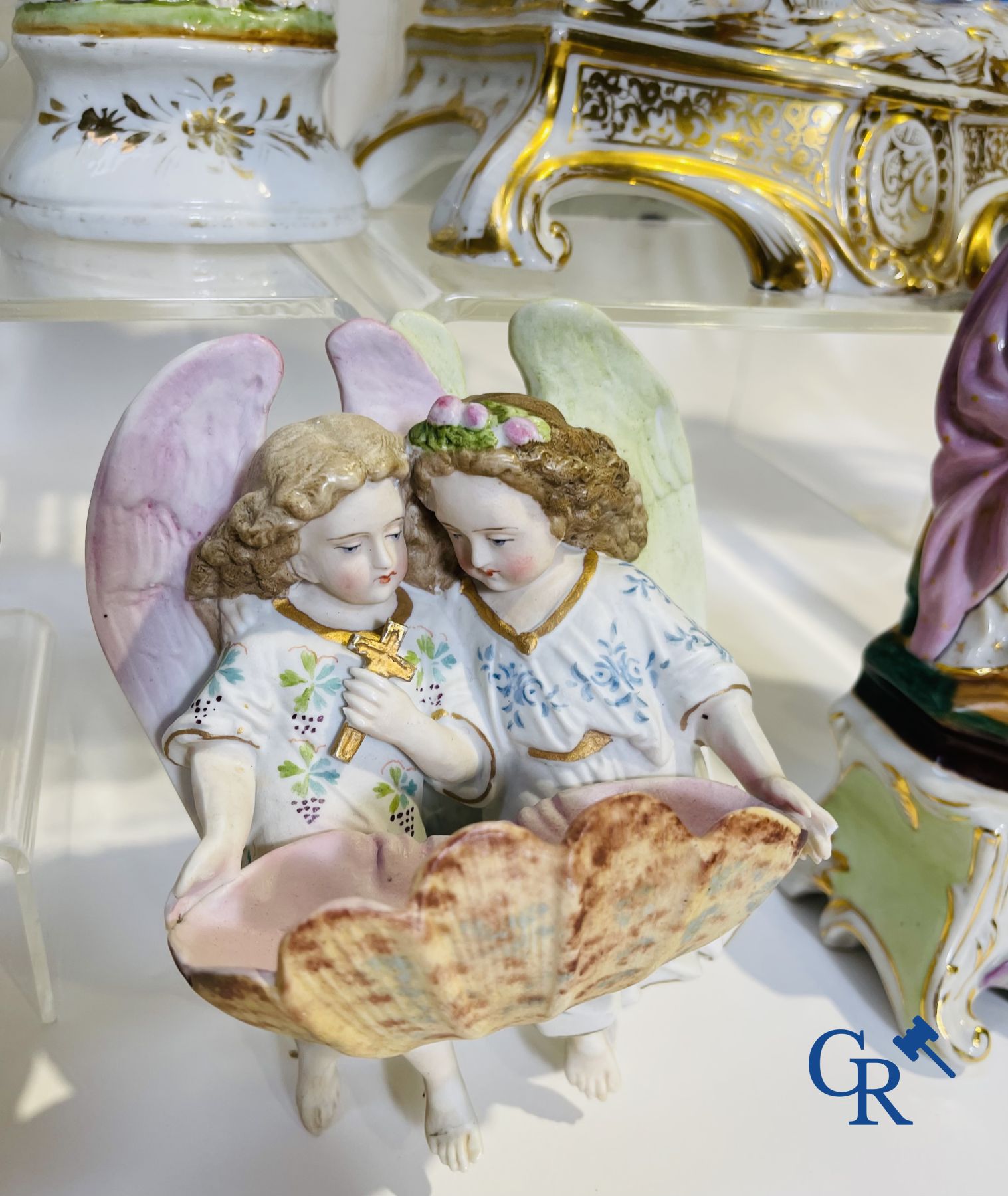 A various lot holy water barrels, shrines and others in porcelain and biscuit.