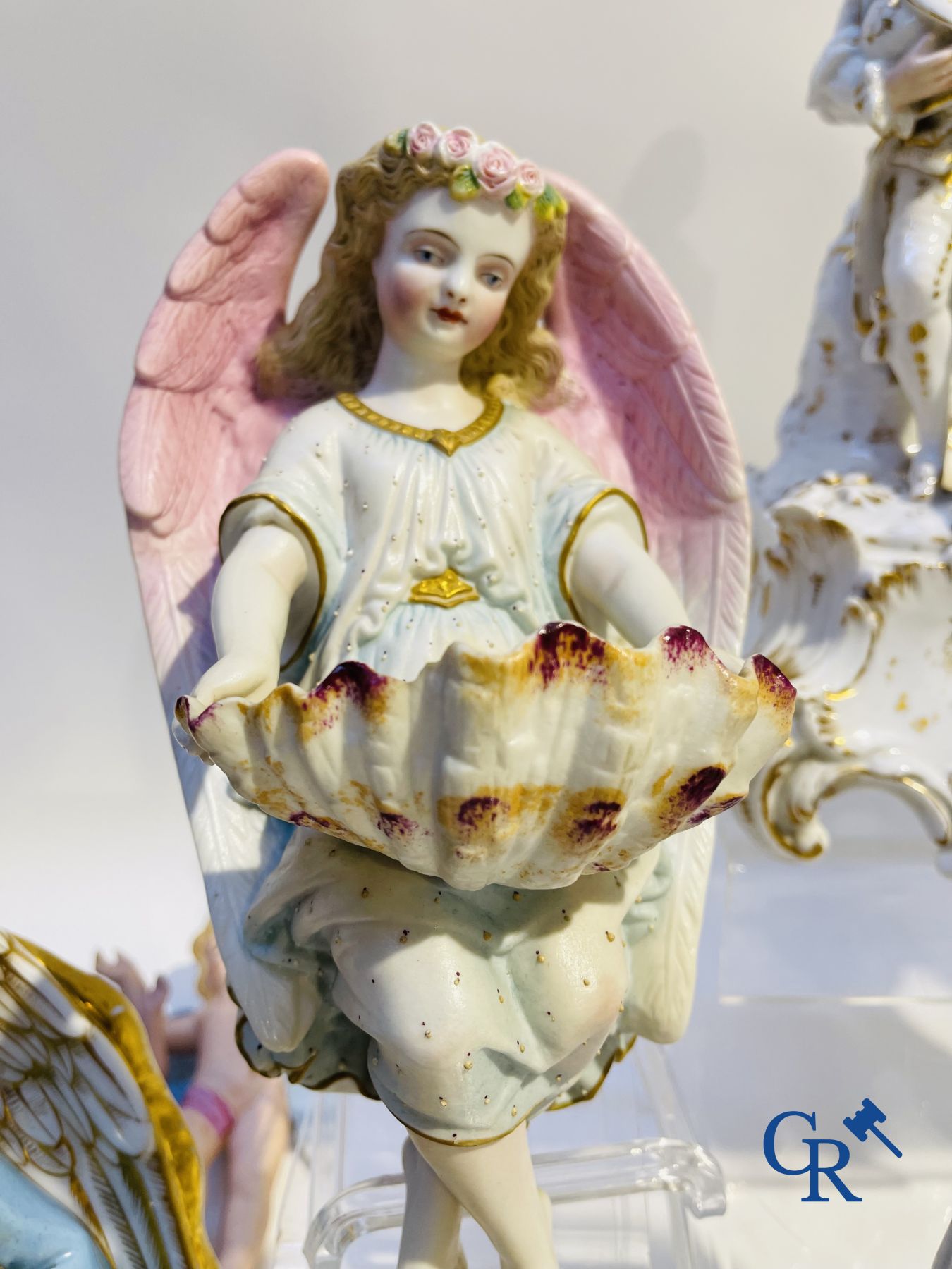 A various lot holy water barrels, shrines and others in porcelain and biscuit.