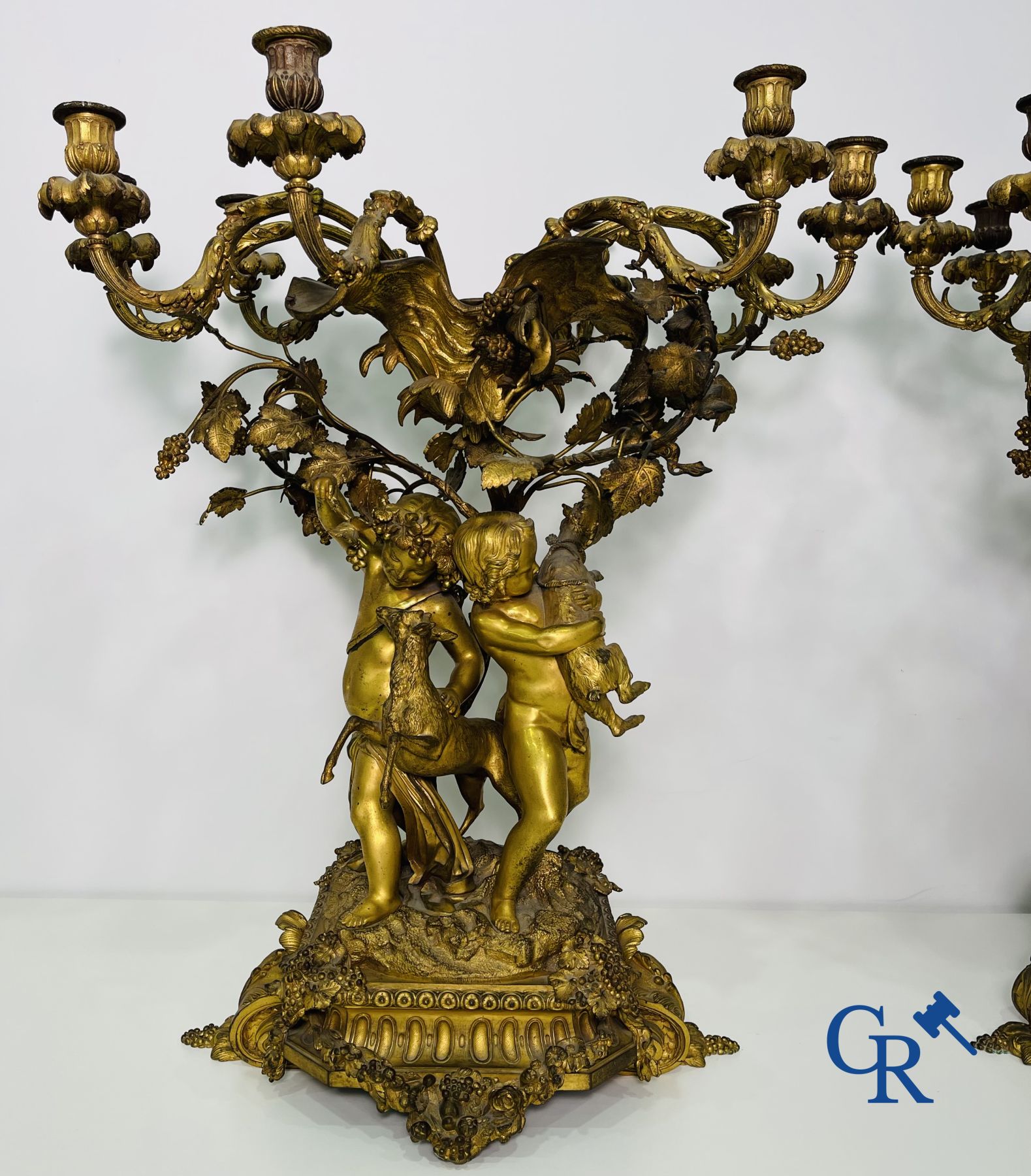 A pair of imposing bronze candlesticks with putti in LXVI style. Napoleon III period.
