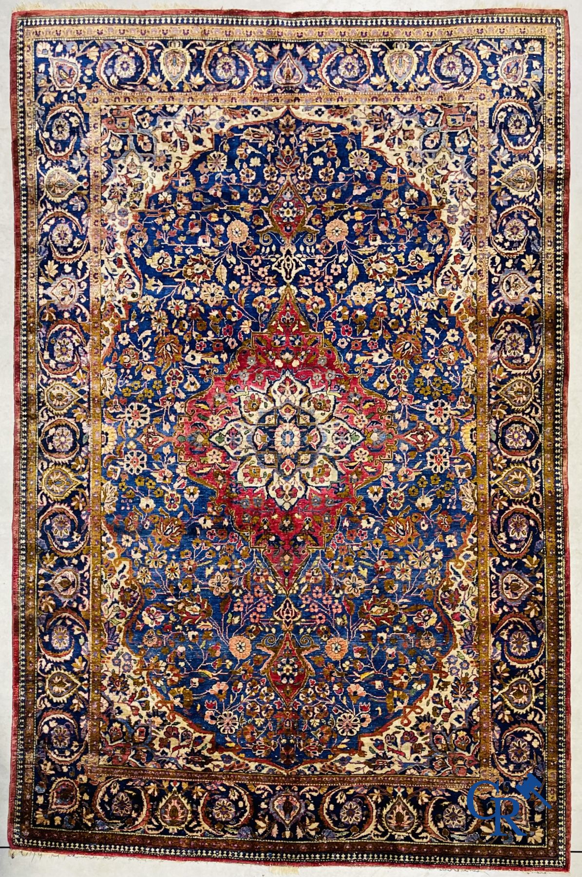 Oriental carpets: Antique silk carpet with floral decor.