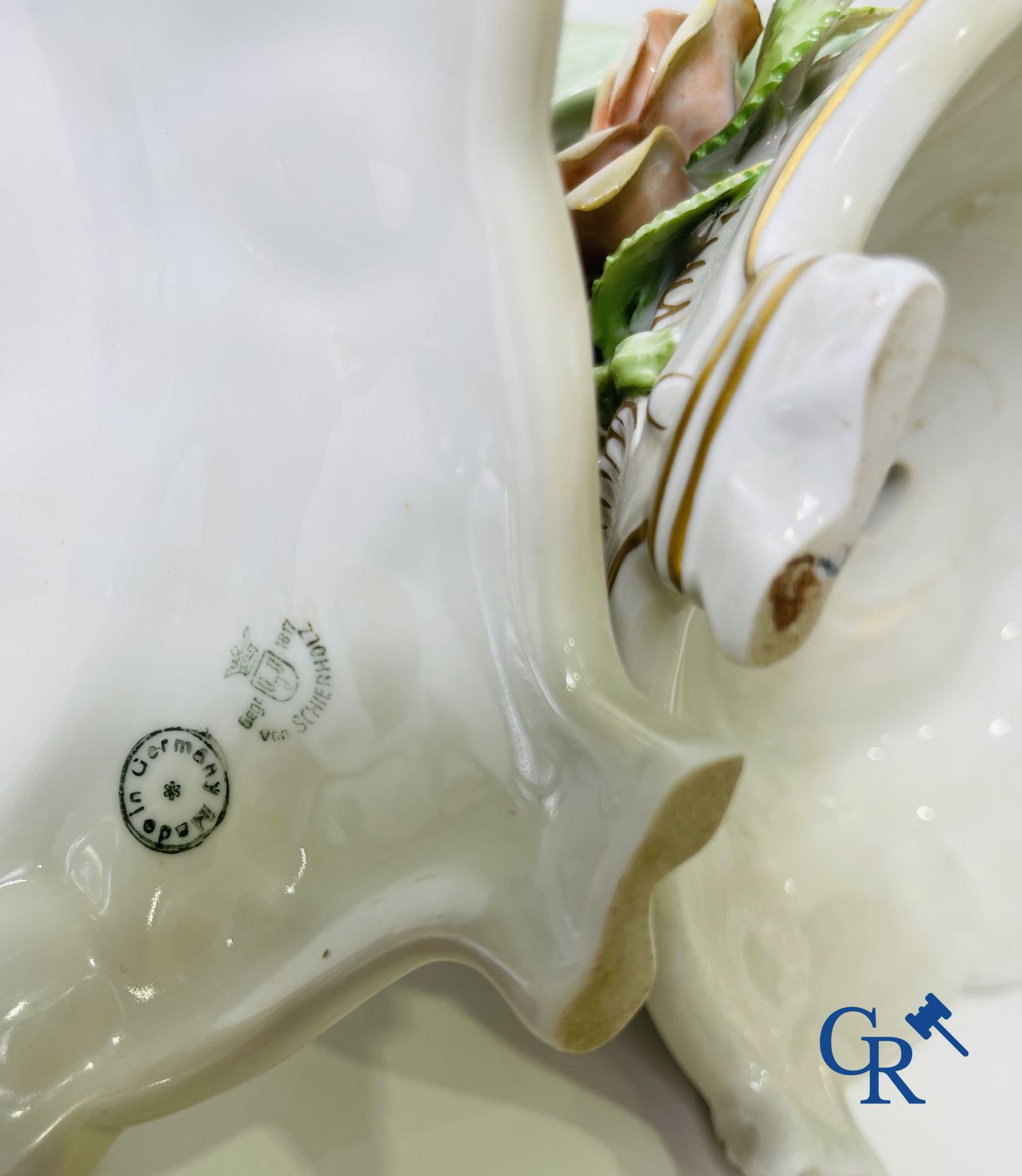 A pair of table centrepieces in German polychrome porcelain.