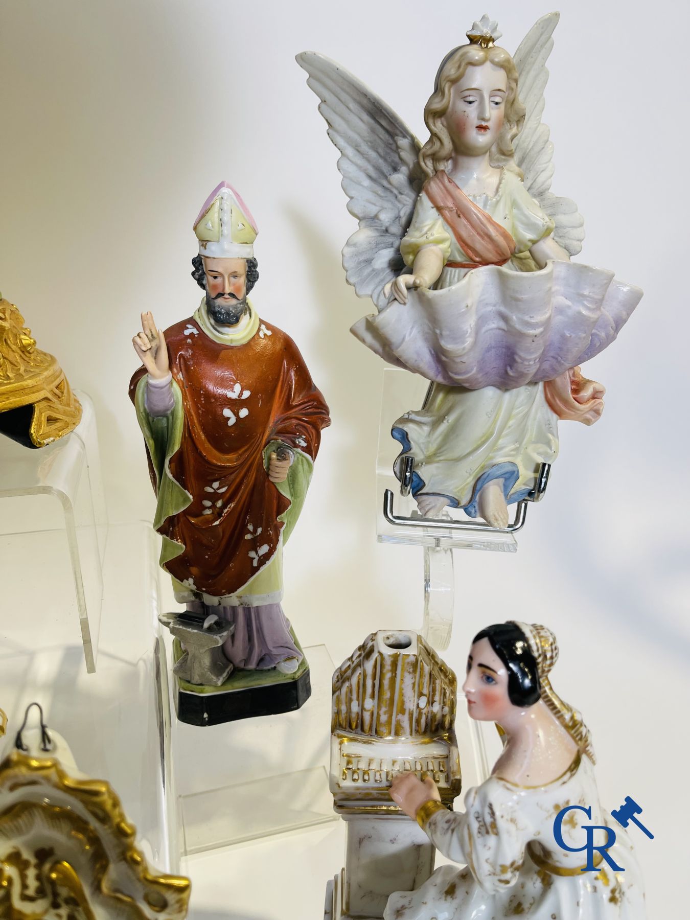 A various lot holy water barrels, shrines and others in porcelain and biscuit.