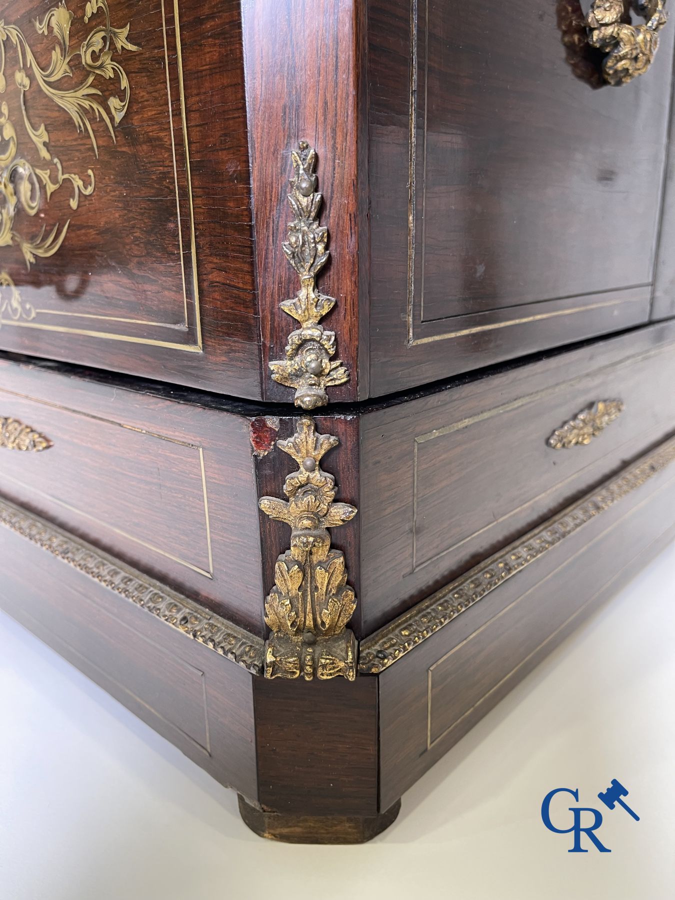 An imposing rosewood liqueur case with bronze fittings and inlays in Boulle style. 19th century.