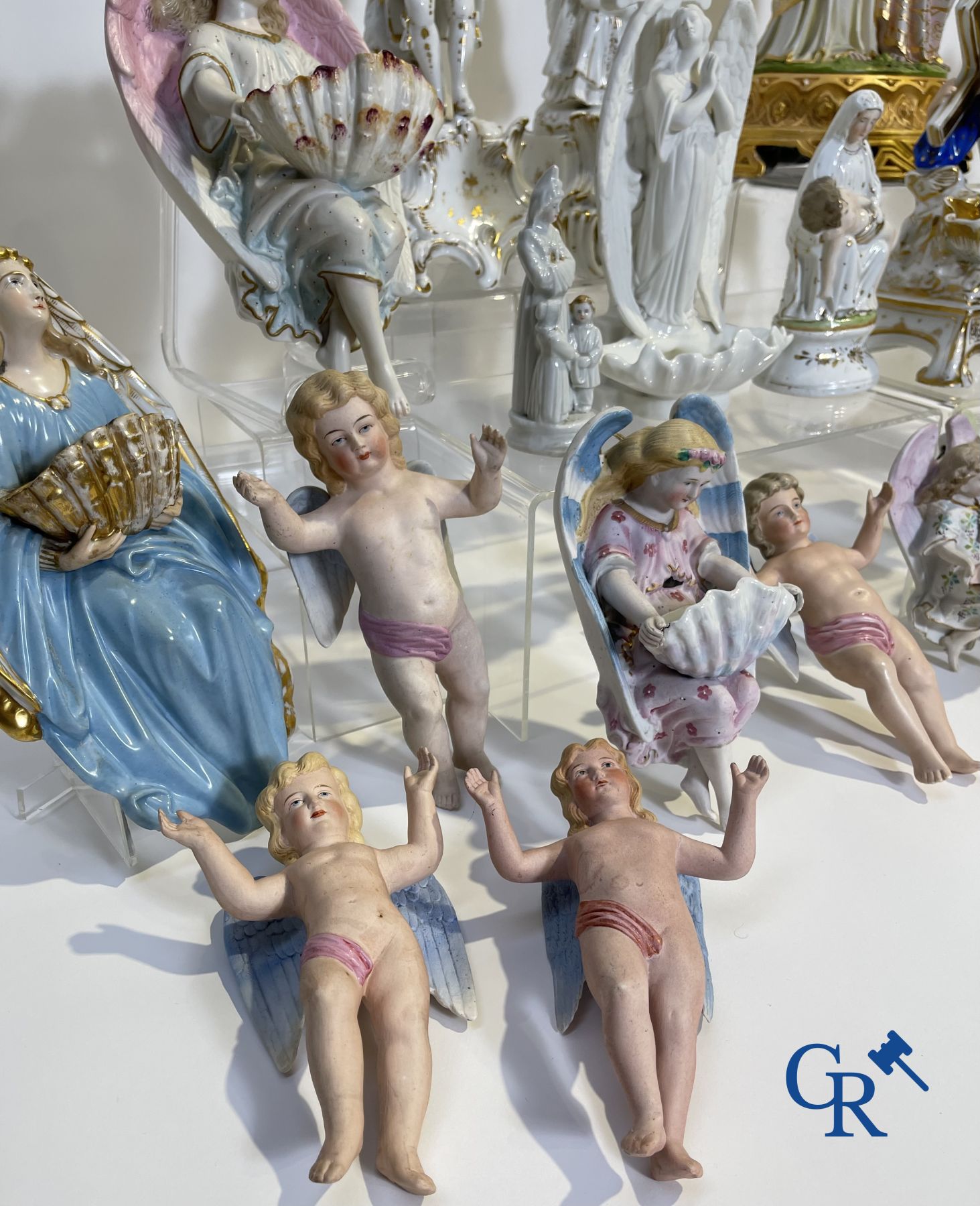 A various lot holy water barrels, shrines and others in porcelain and biscuit.